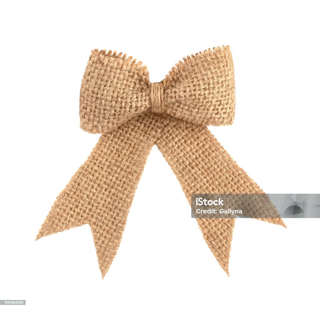 Burlap ribbon bow isolated on white background Burlap ribbon bow for holiday present decoration isolated on white background Tied Bow Stock Photo