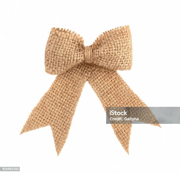 Burlap Ribbon Bow Isolated On White Background Stock Photo - Download Image Now - Tied Bow, Burlap, Natural Condition