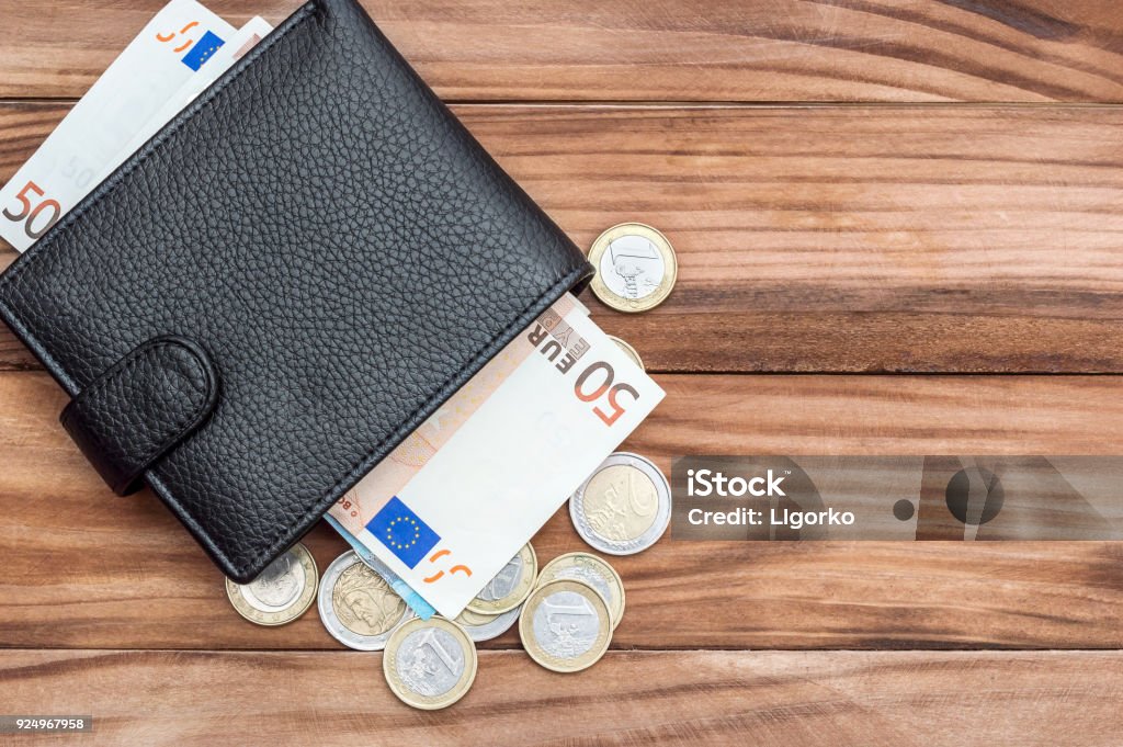 Wallet with euro bills and coins on the table. Top view. Copy space. Business background. Wallet Stock Photo