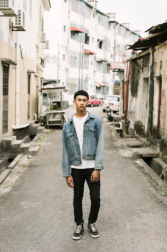 Young asian man in a back alley