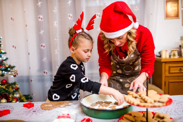 istock Happy young girl with her mother making dough 924968930