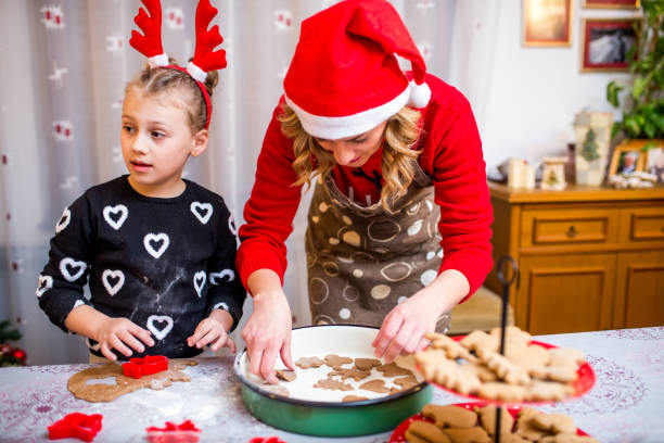 istock Happy young girl with her mother making dough 924968938