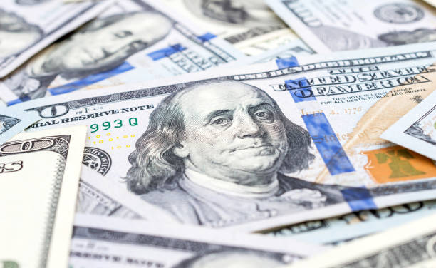 istock One hundred dollar bills. Close up. Business background. 924969212