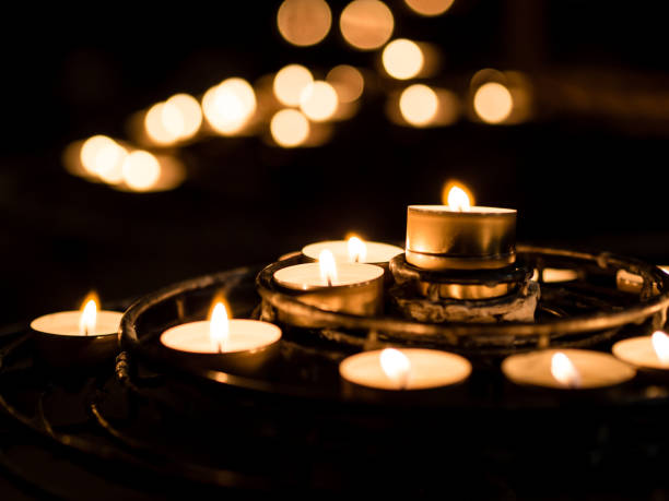 istock candles in dark church 924969330
