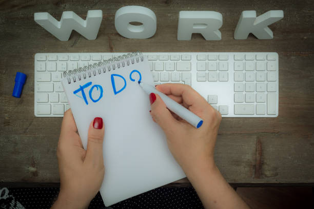 istock Woman starting a to do list at work 924969548