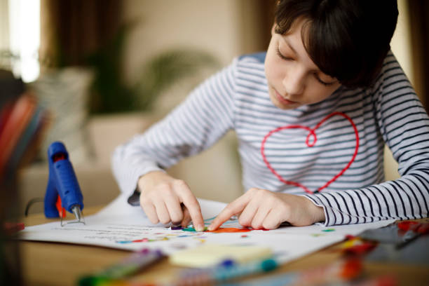 istock Cute young girl working on creative art and craft project 924969830