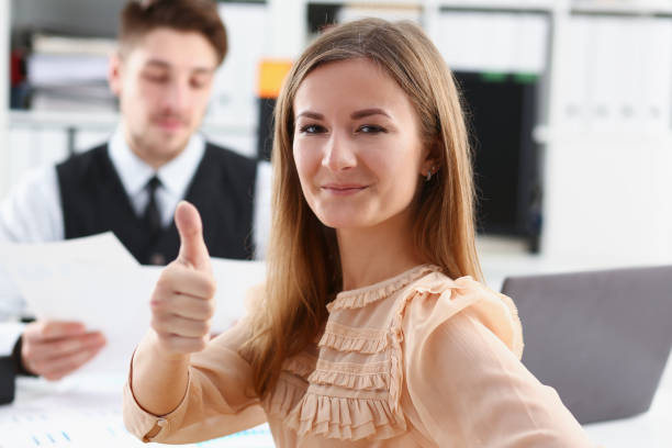 istock Beautiful smiling woman showing OK 924972642