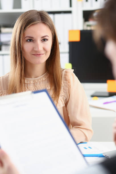 istock Smiling woman offer contract form 924972668
