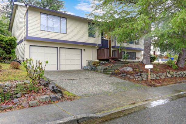 istock Nice beige home with wood siding and blue accent trim 924977106