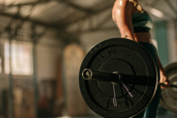 istock Heavy weights exercises performed by female athlete 924978938