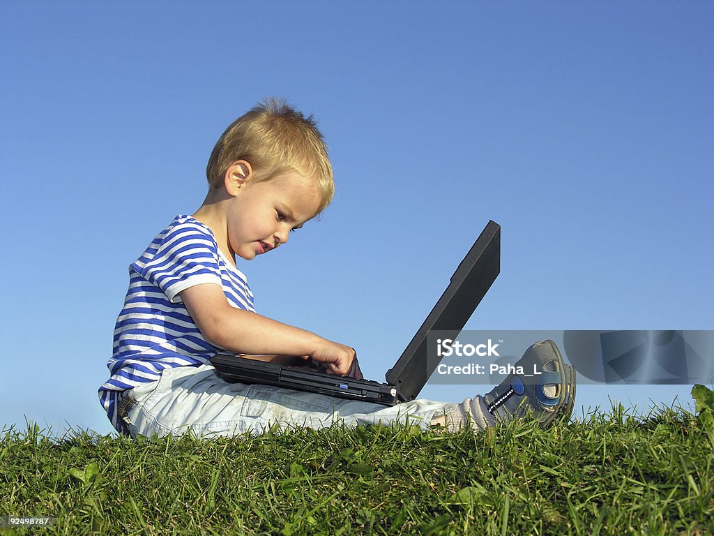 child with notebook sit blue sky  Blue Stock Photo