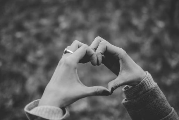 istock Tender girl's pale hands forming a heart shape gesture. 924989124