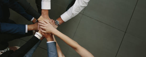 istock Business team putting hands together 924989678