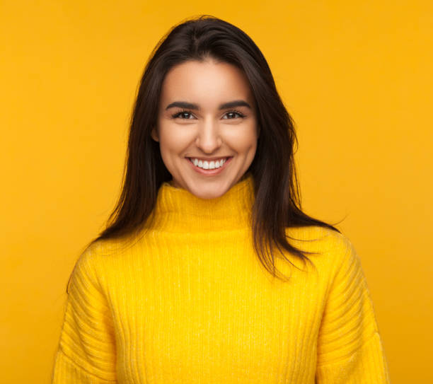 istock Charming young model in yellow sweater 924989788