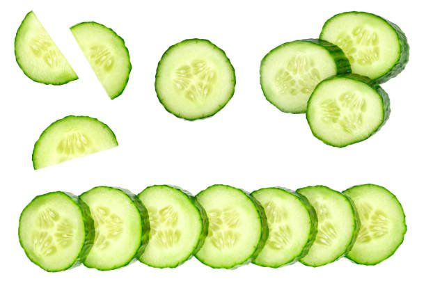 Collection of fresh green cucumbers isolated on white background. Set of multiple images. Part of series Collection of fresh green cucumbers isolated on white background. Set of multiple images. Part of series cucumber slice stock pictures, royalty-free photos & images