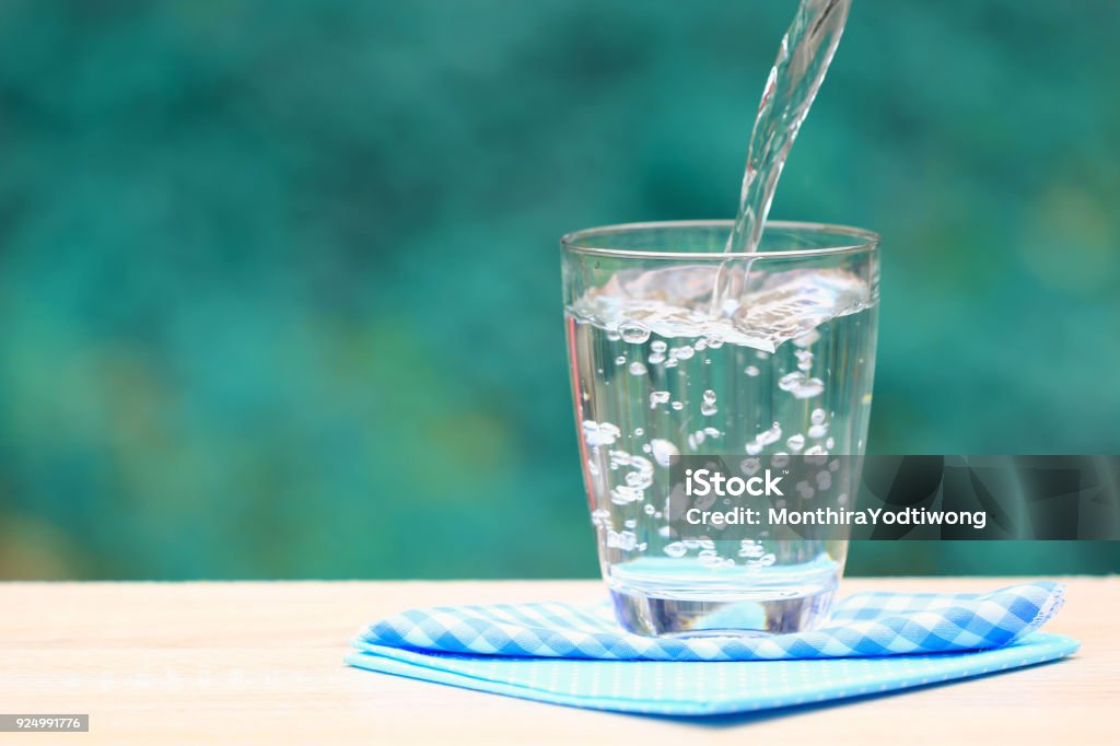 Closeup Glass of water on table nature background Water Stock Photo