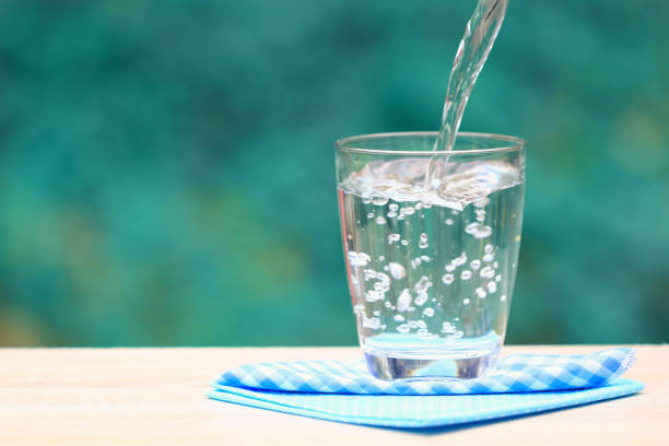 Closeup Glass of water on table nature background Closeup Glass of water on table nature background purified water photos stock pictures, royalty-free photos & images