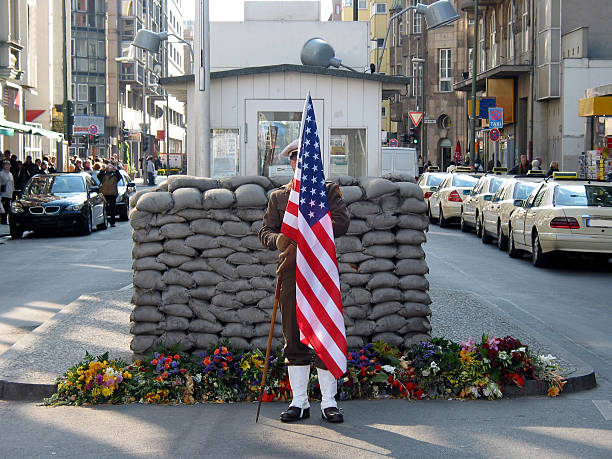 Beautiful view of checkpoint Charlie holding a US flag stock photo