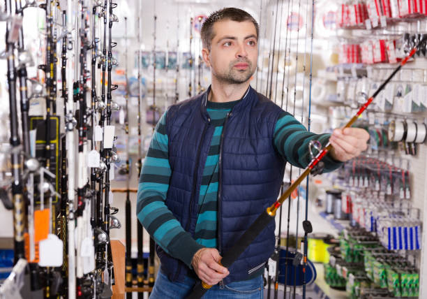 istock customer selectioning fishing rod 924994898