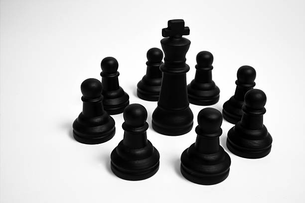 istock Black pawns and the king 92499682