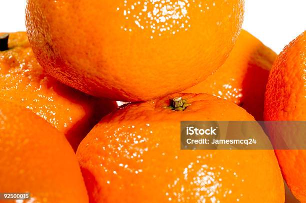 Macro Naranjas Foto de stock y más banco de imágenes de Alimento - Alimento, Blanco - Color, Cerca de