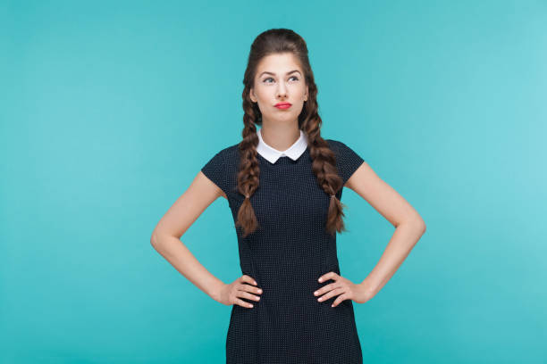 istock Thoughtful woman looking up and pondering. 925000624