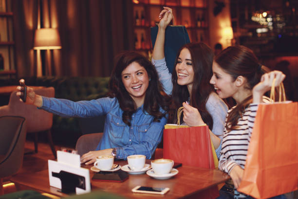 istock Three women making selfie after shopping in a cafe 925008428