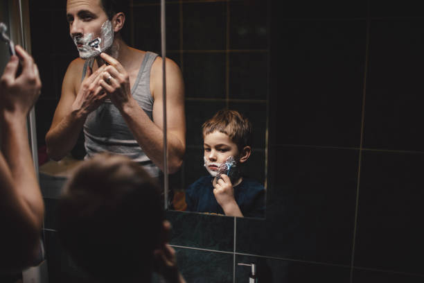 shaving together - shaving men shaving cream mirror imagens e fotografias de stock