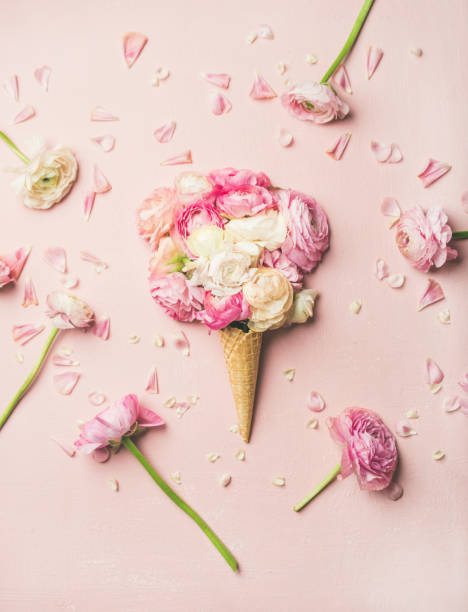 istock Waffle cone with pink and white buttercup flowers 925013150