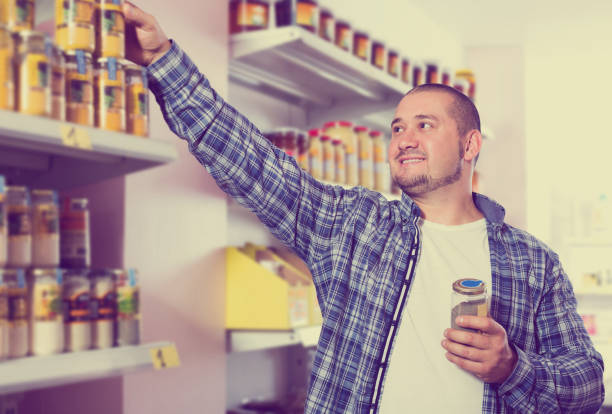 istock Man purchasing peanut butter in grocery 925017308