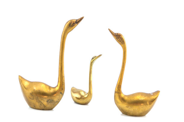 istock Brass Swan isolated on white background. 925017514