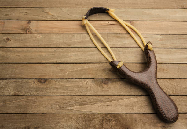 istock Modern Slingshot on a Wooden Table 925021624