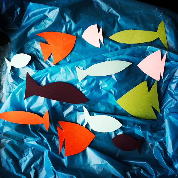 istock Paper Fish on Plastic Grocery Bags Concept 925029310