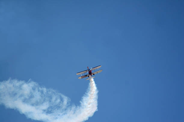 Smoking Stunt Airplane stock photo