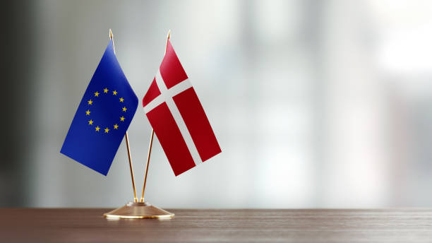 istock European Union And Danish Flag Pair On A Desk Over Defocused Background 925033008