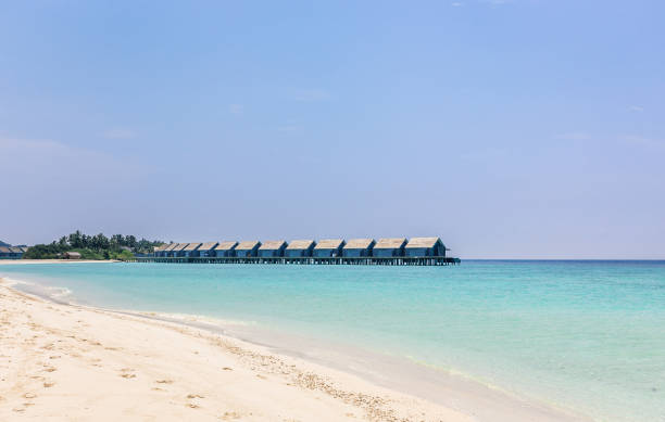 istock Blue lagoon and tropical island in Maldives 925036572