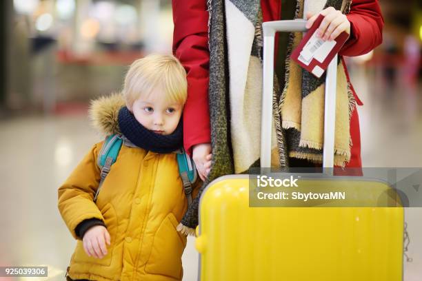 Closeup Photo Of Woman With Little Boy At The International Airport Stock Photo - Download Image Now