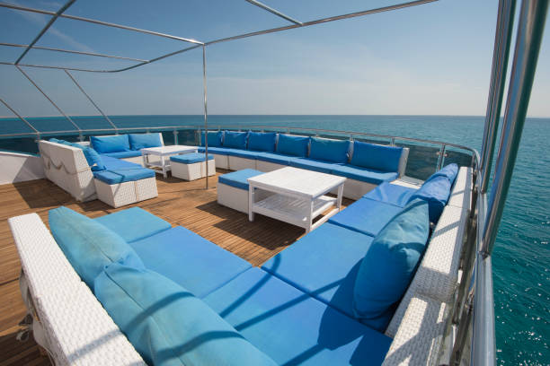 istock Table and chairs on deck of a luxury motor yacht 925040016