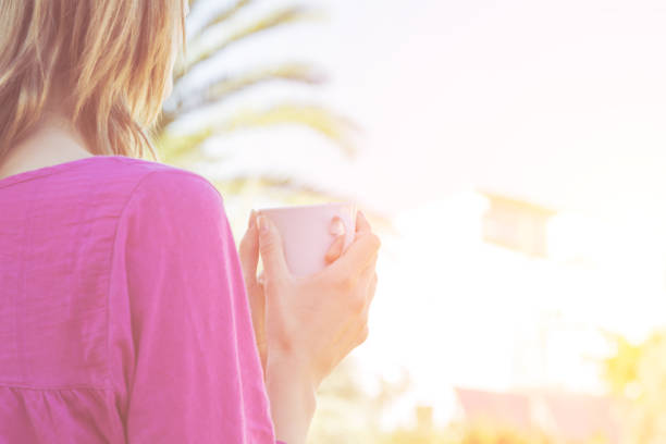 istock Girl enjoying her morning coffee on a terrace. 925040432