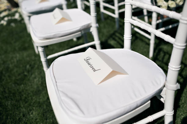 istock Beautiful wedding ceremony design decoration elements with fresh flowers composition, floral design, petals roses and chairs. 925040812