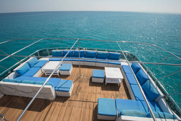 istock Table and chairs on deck of a luxury motor yacht 925043652