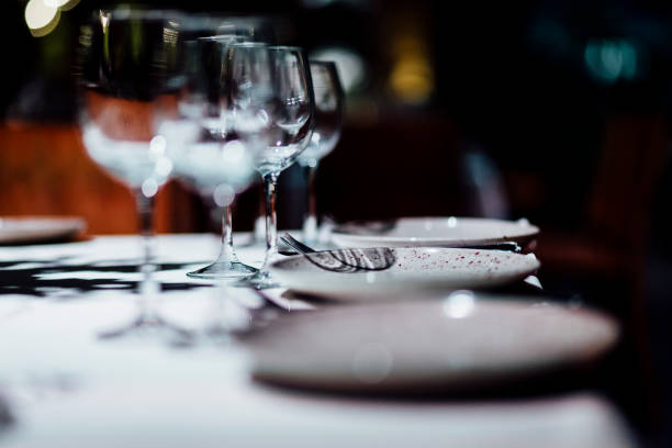 istock Luxury table settings for fine dining with and glassware, beautiful blurred  background. For events, weddings. 925043938