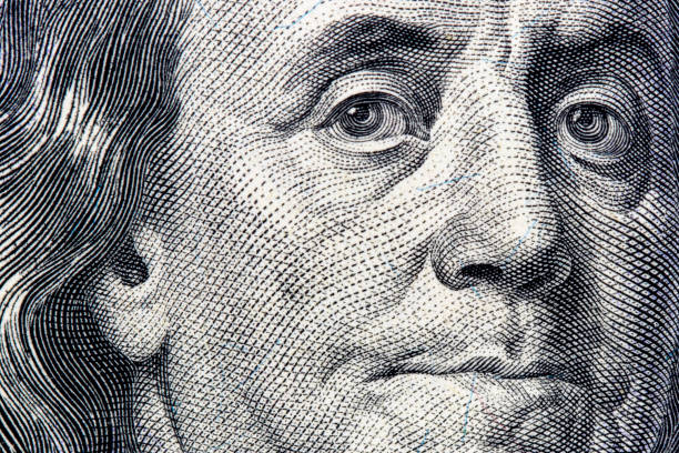 istock Benjamin Franklin portrait close-up on 100 dollars banknote 925044340