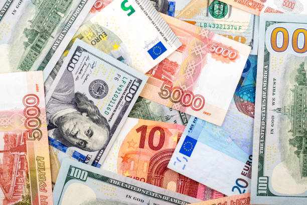 istock New one hundred dollar, euro and ruble bills background 925046848