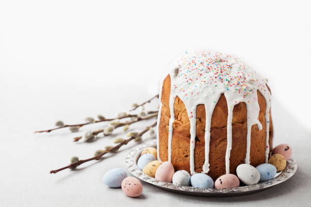 Traditional Russian Orthodox Easter bread - kulich Traditional Russian Orthodox Easter bread - kulich with willow twigs and chocolate eggs easter cake photos stock pictures, royalty-free photos & images