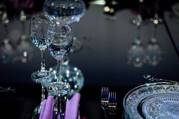 Luxury table settings for fine dining with and glassware, beautiful blurred  background. For events, weddings.