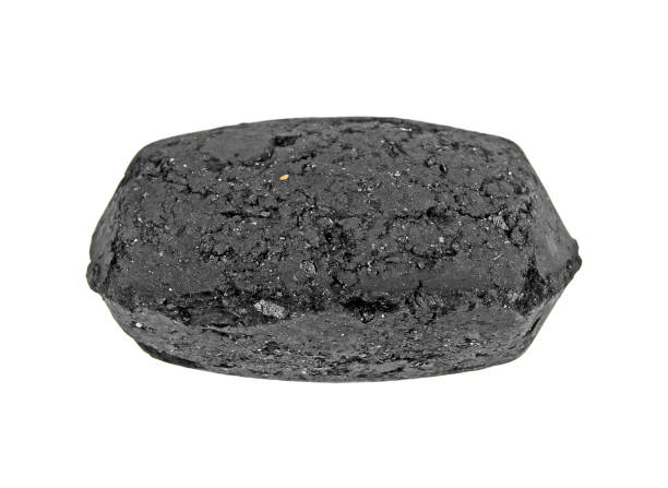 istock Coal briquette for BBQ isolated on a white background 925048156