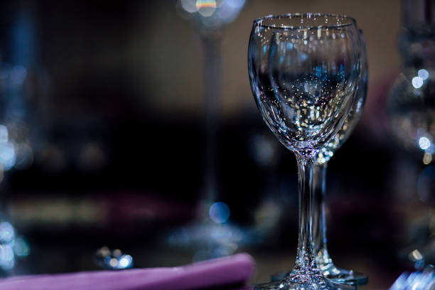 Luxury table settings for fine dining with and glassware, beautiful blurred  background. For events, weddings.