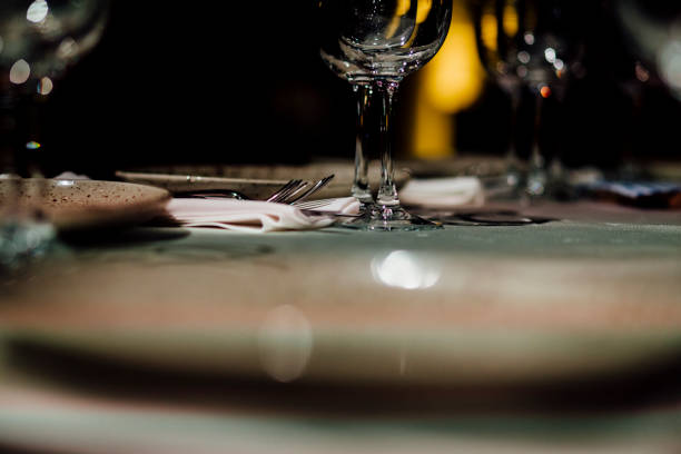 Luxury table settings for fine dining with and glassware, beautiful blurred  background. For events, weddings.