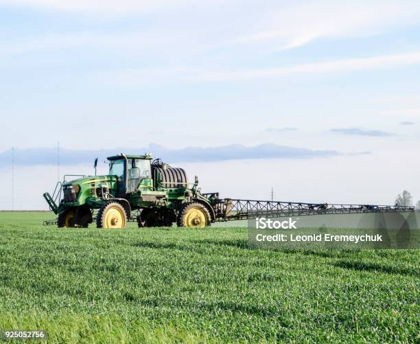 Tractor With A Spray Device For Finely Dispersed Fertilizer Stock Photo - Download Image Now